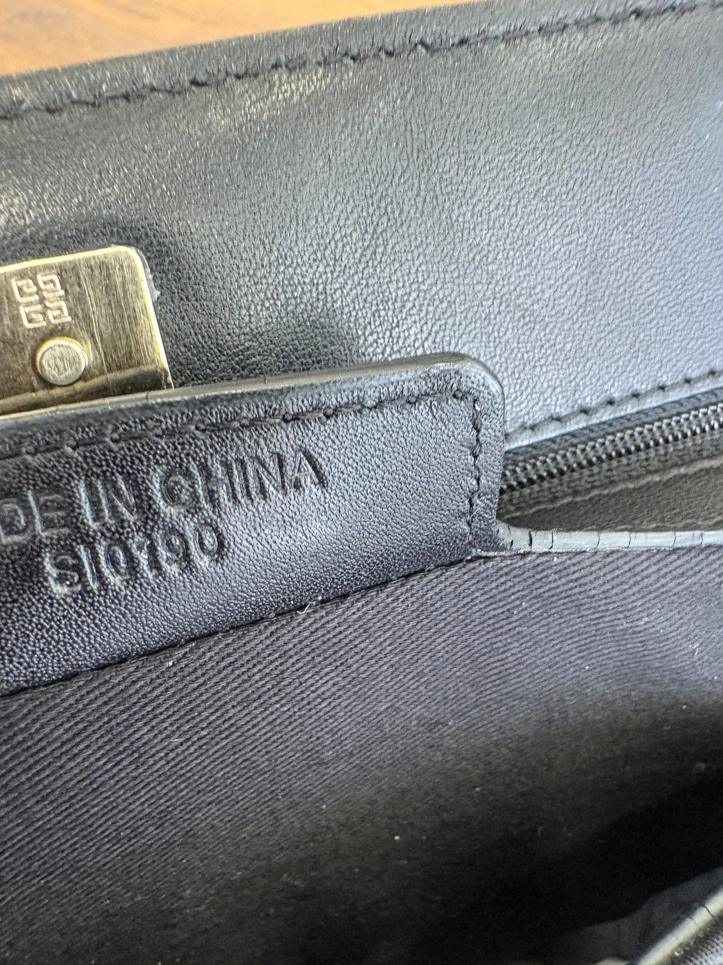 Givenchy pochette nylon e specchietti ambrati