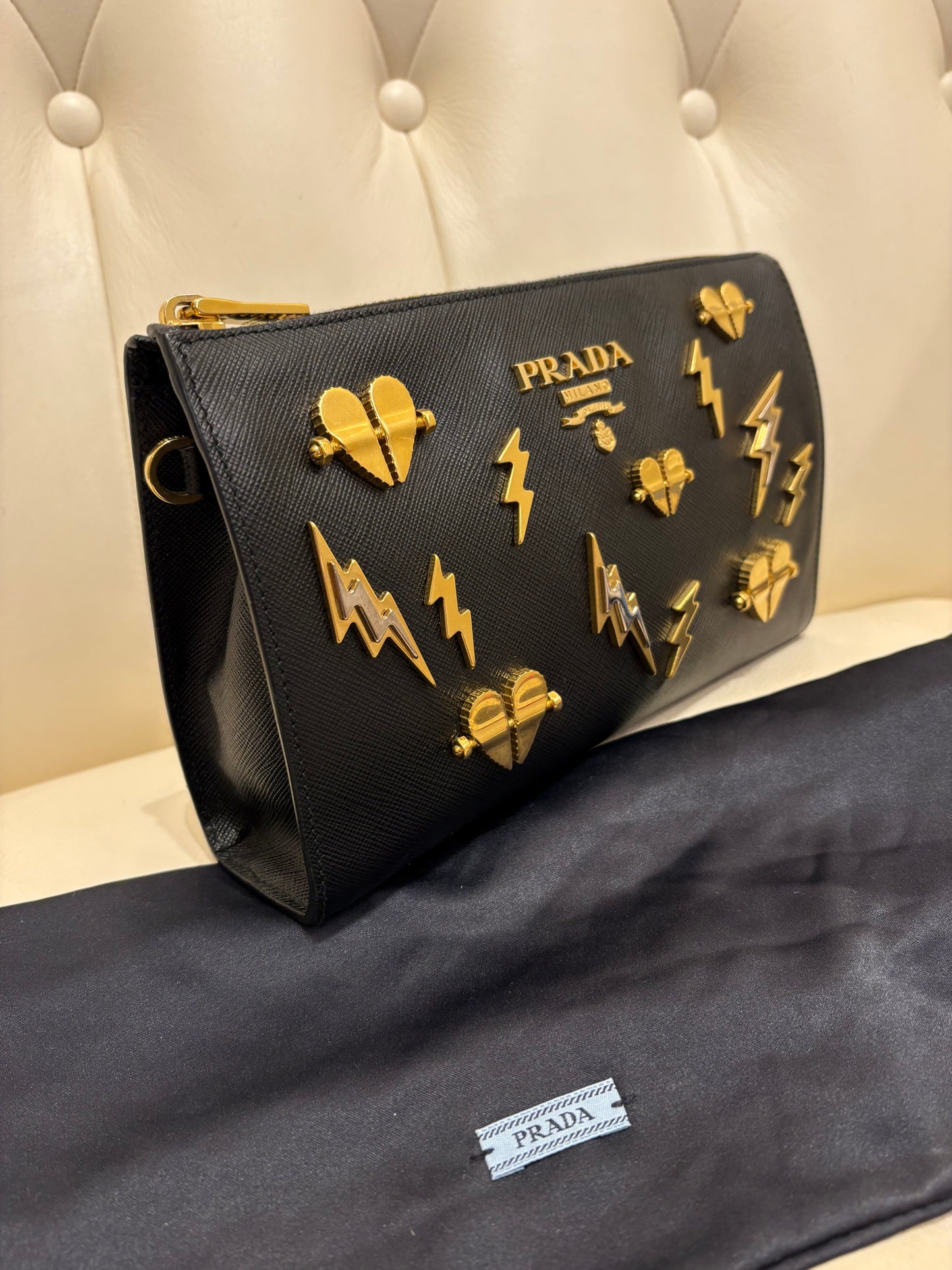 Prada pochette pelle saffiano metallo dorato