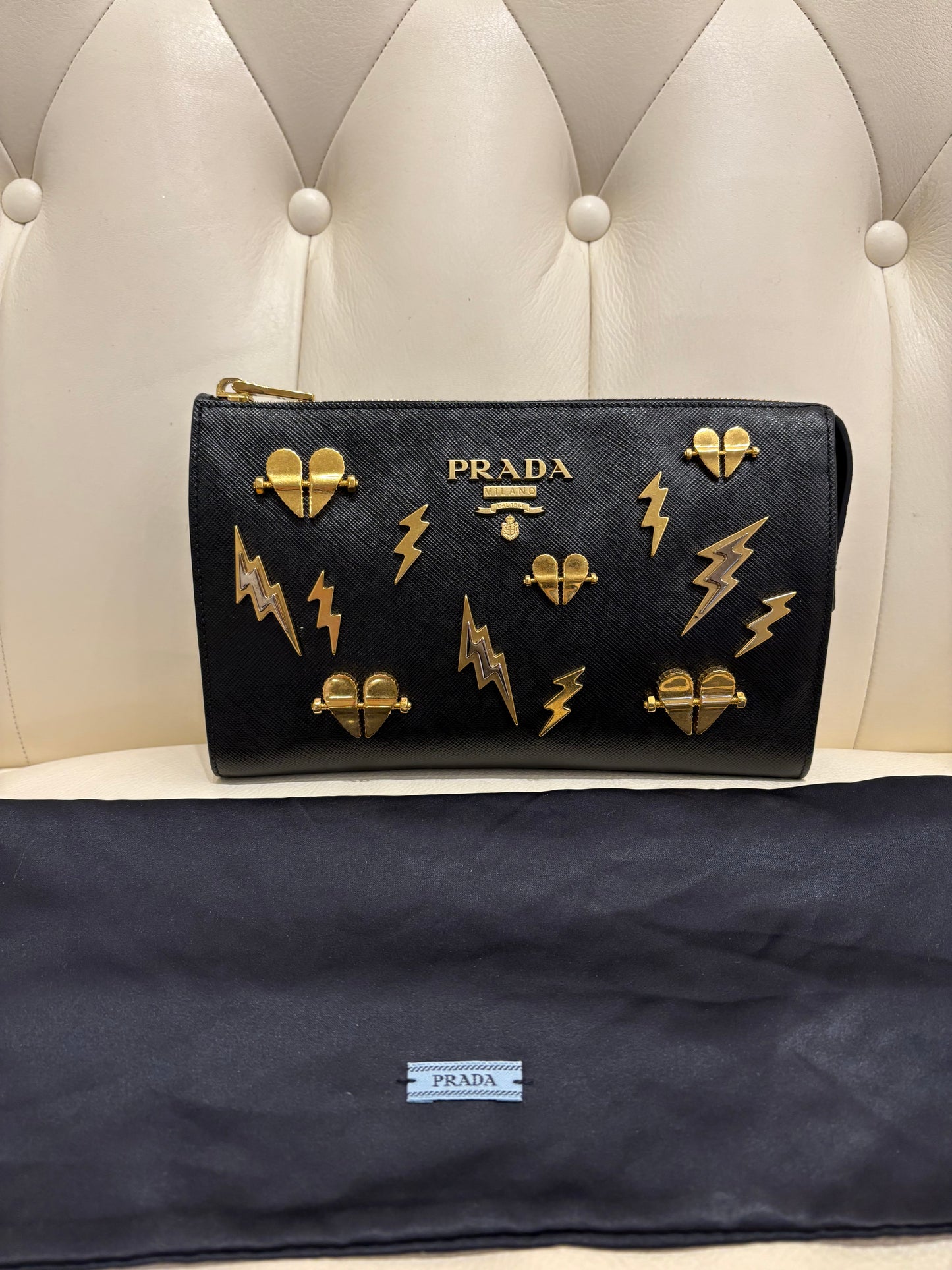 Prada pochette pelle saffiano metallo dorato