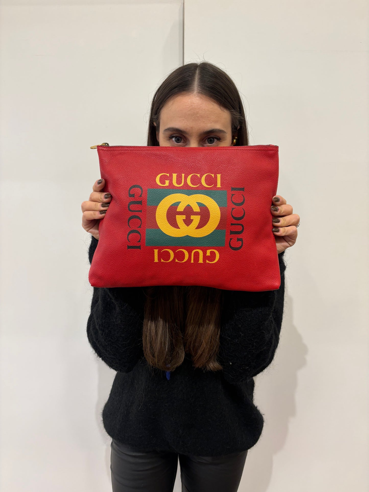 Gucci pochette in pelle con logo stampato