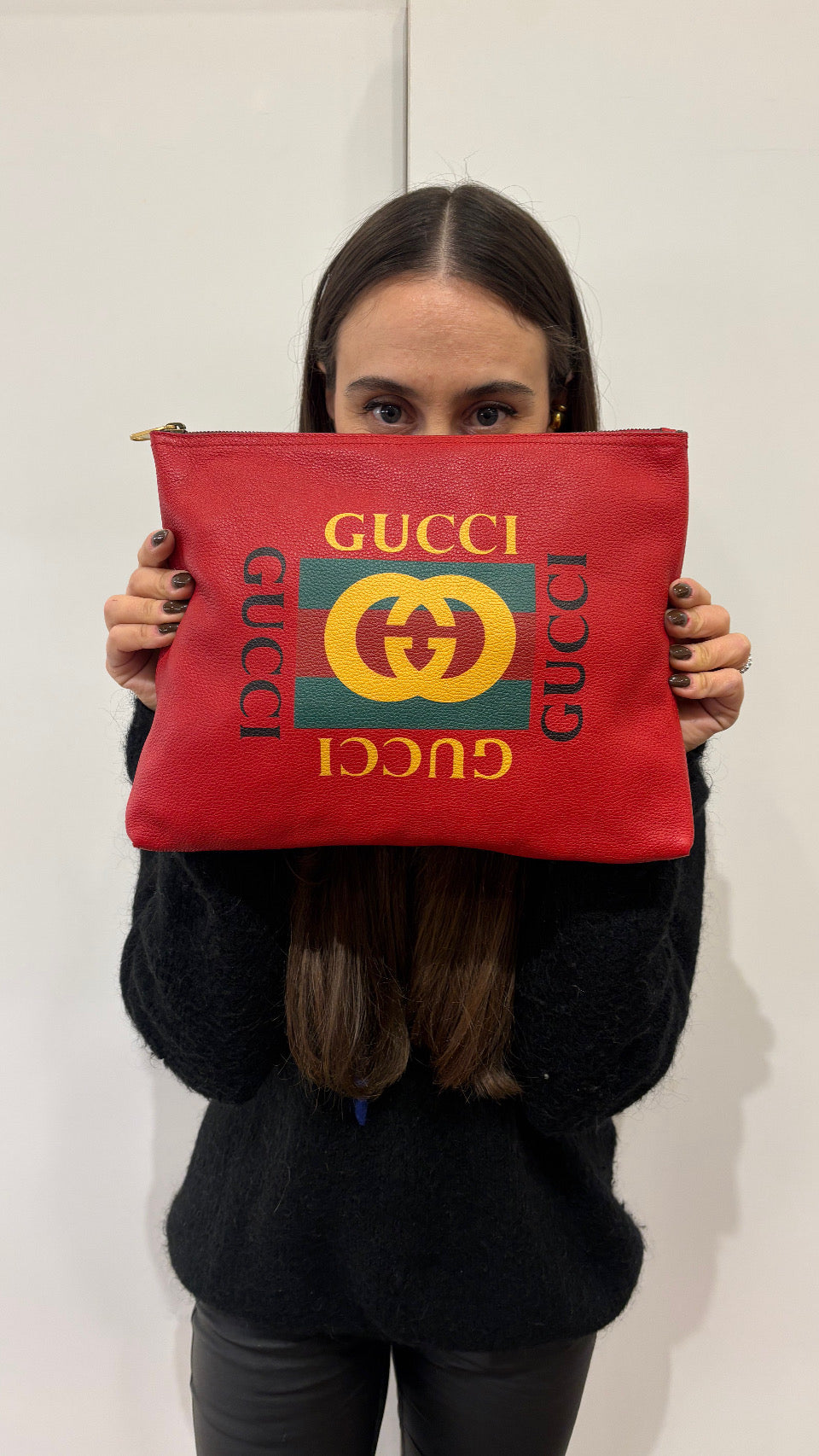 Gucci pochette in pelle con logo stampato
