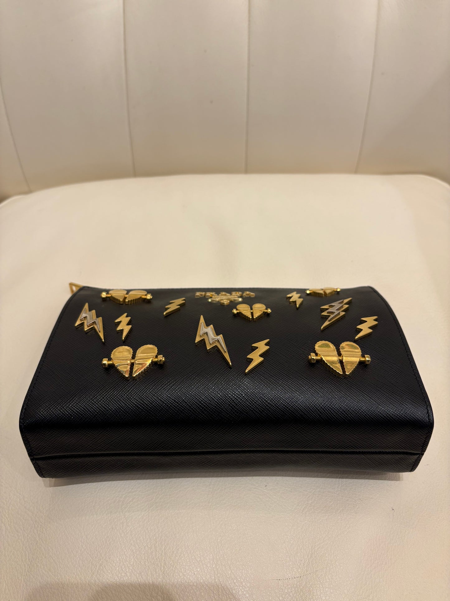 Prada pochette pelle saffiano metallo dorato